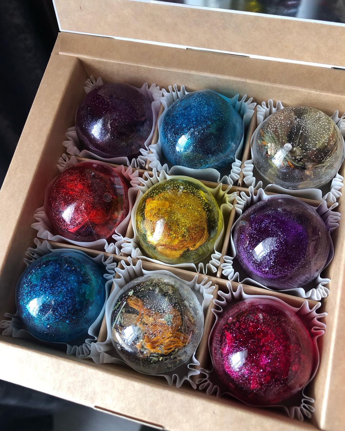 Tea bombs with botanicals inside in a presentation box